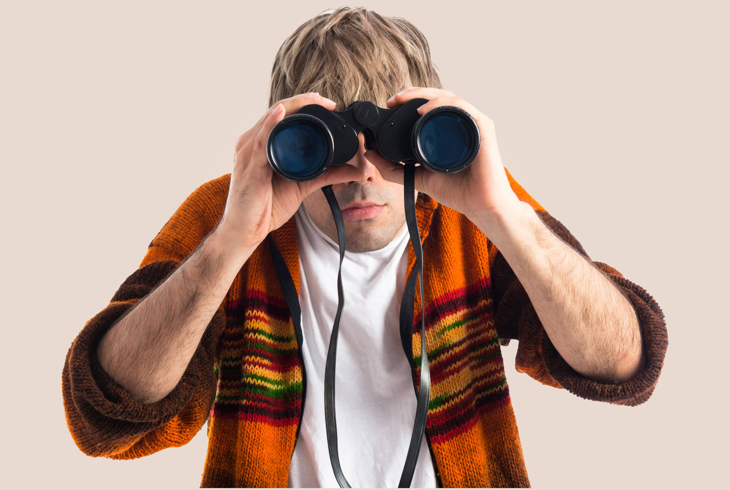 Blonde man with binoculars